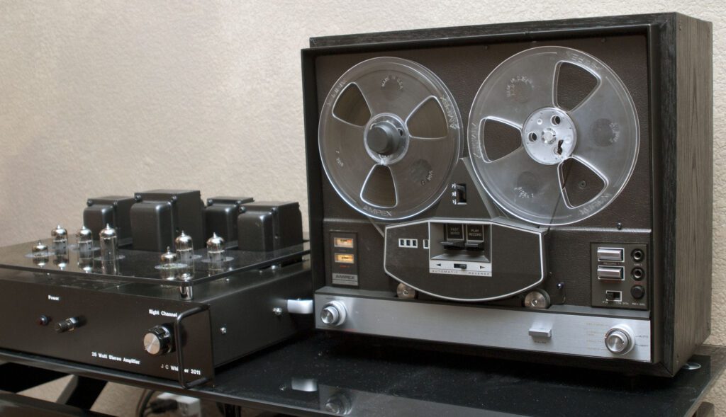 A black and silver stereo on top of a table.