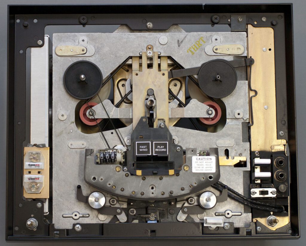 A disassembled computer with the top of it open.