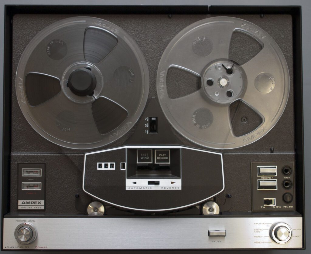 A close up of an old fashioned reel to reel tape recorder