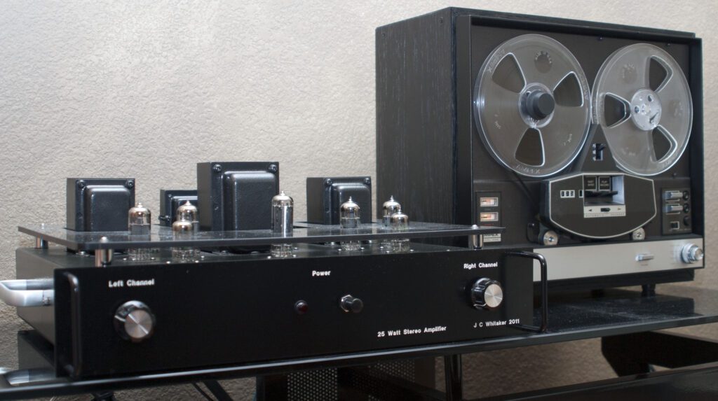 A black and silver stereo system on top of a table.