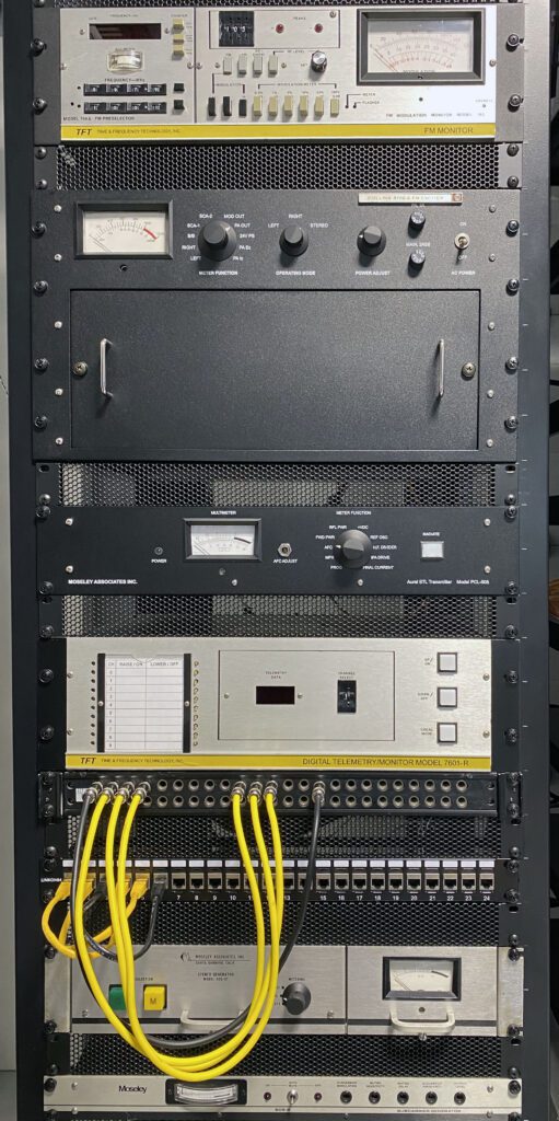 A rack with many wires and a panel