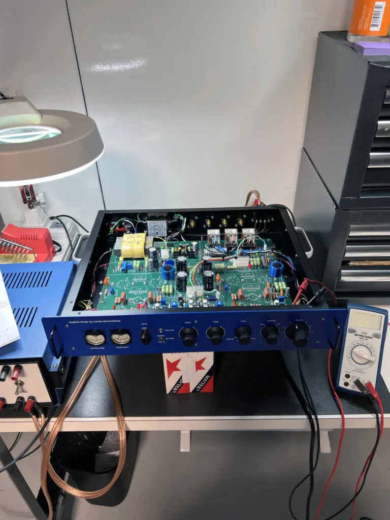 A blue and black electronic board on top of a desk.