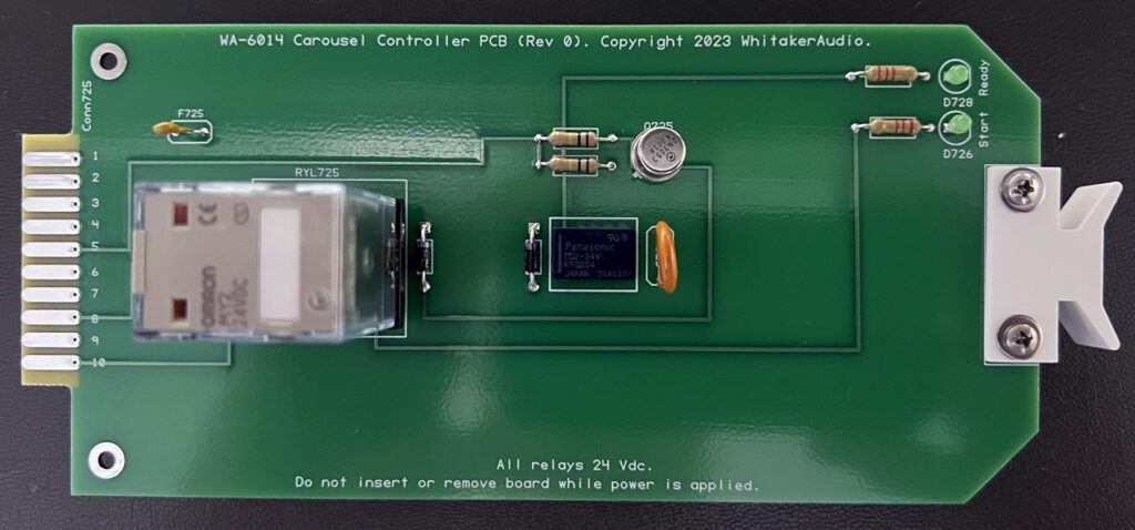 A green board with some electronic components on it