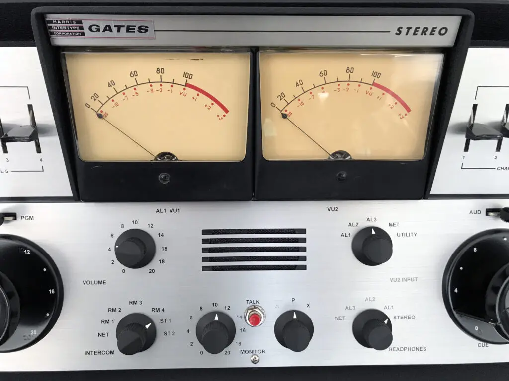 A close up of two different gauges on the front of a stereo