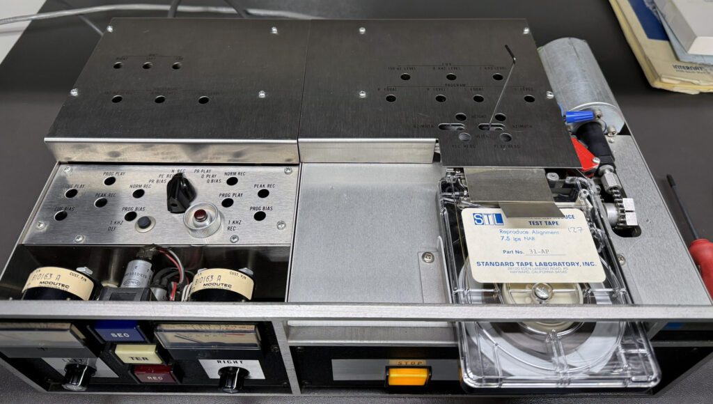 A metal box with some electronic equipment inside of it