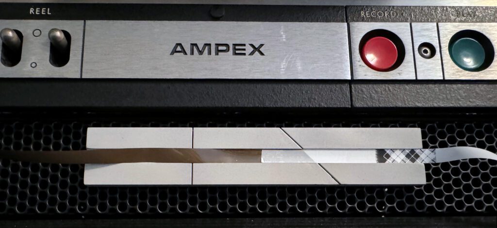 A close up of the front and back of an ampex tape recorder.