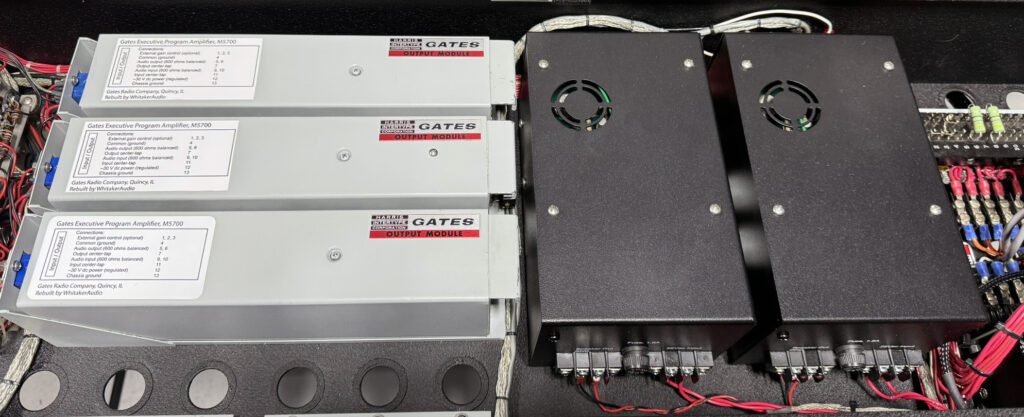 A group of three power supplies sitting next to each other.